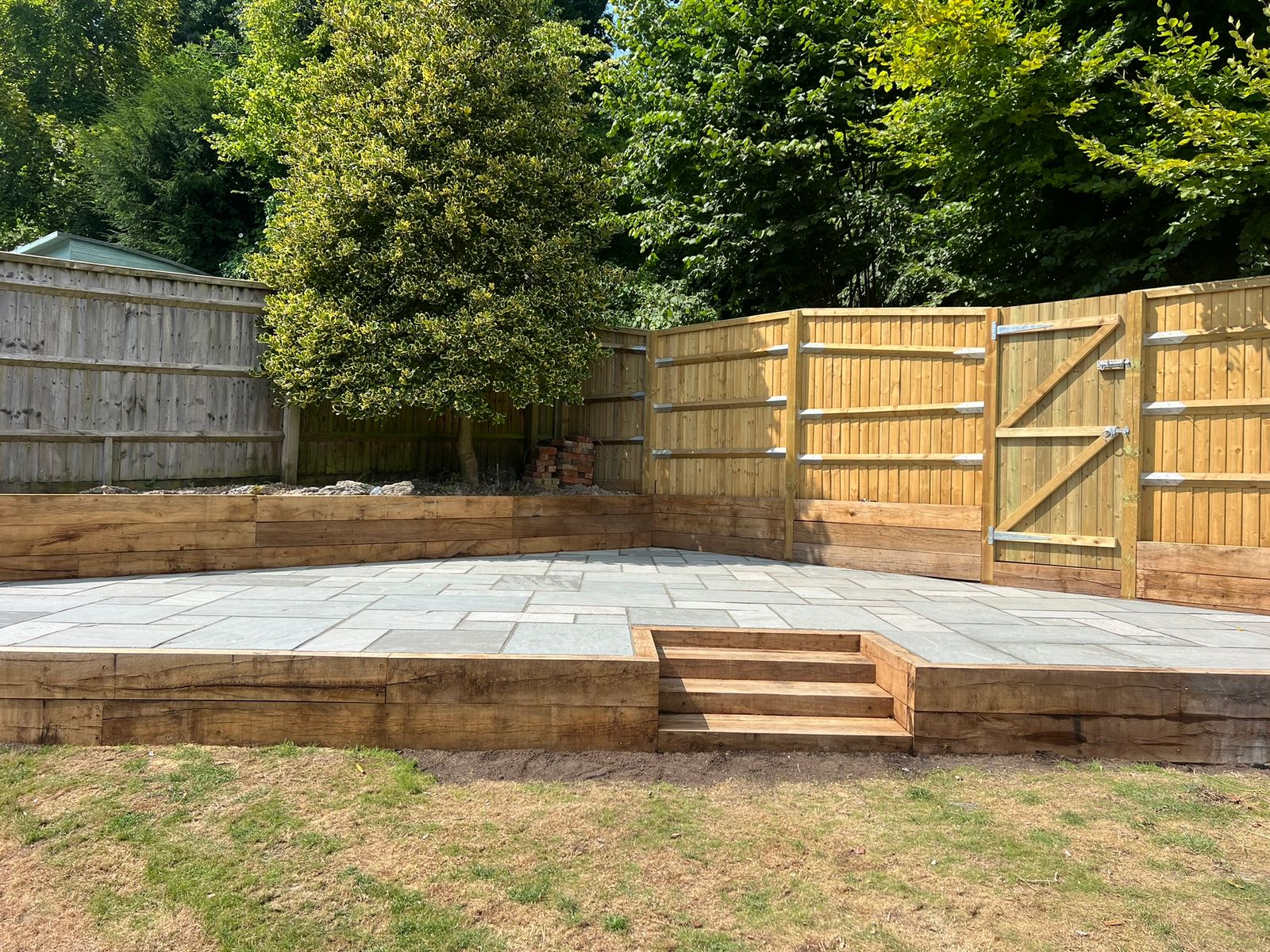 Sandstone Patio With sleeper retaining wall - view 3