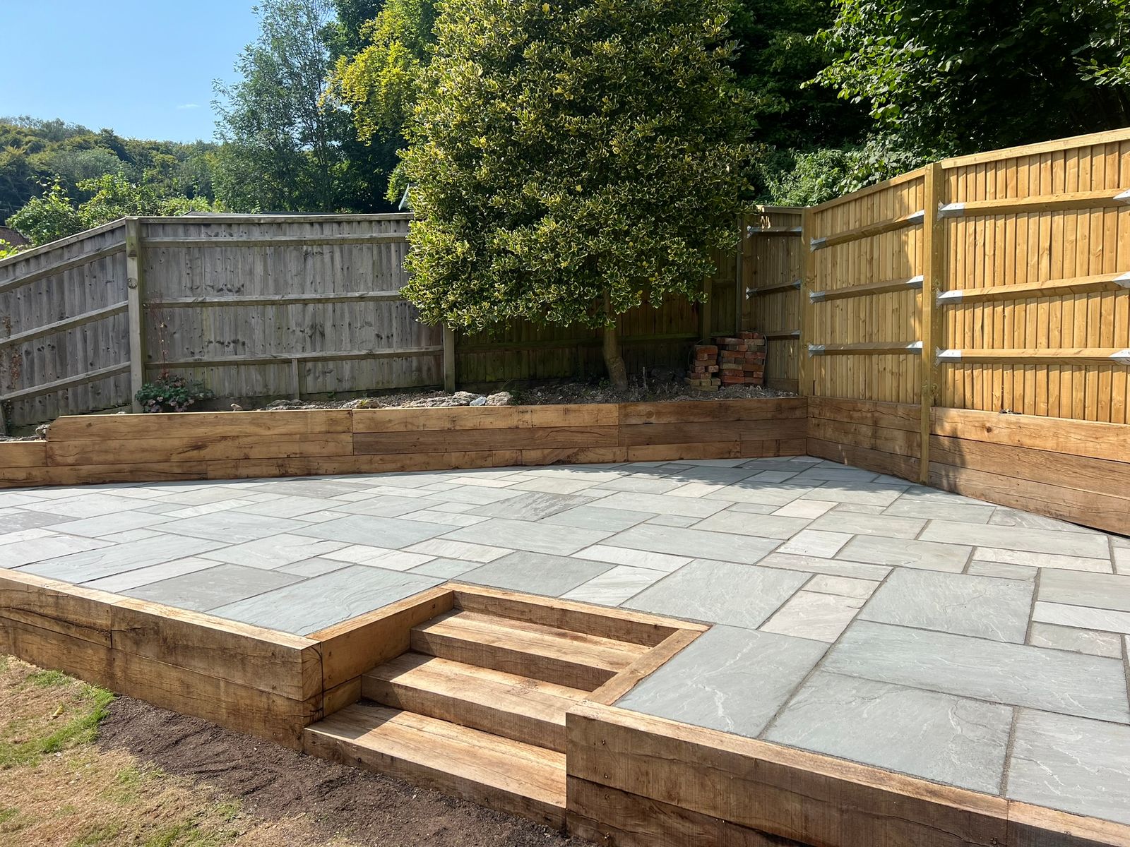 Sandstone Patio With sleeper retaining wall - view 4