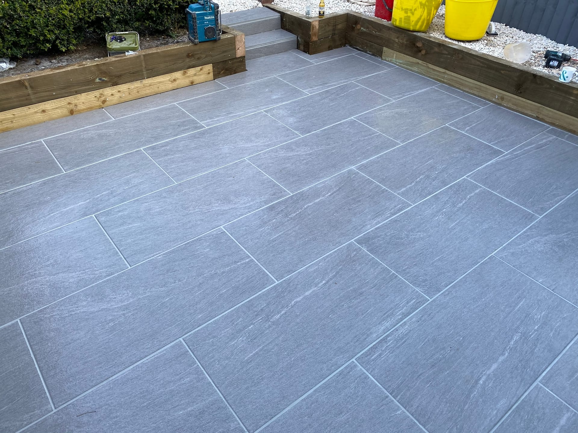 Porcelain Patio with Sleeper Retaining Wall - view 2
